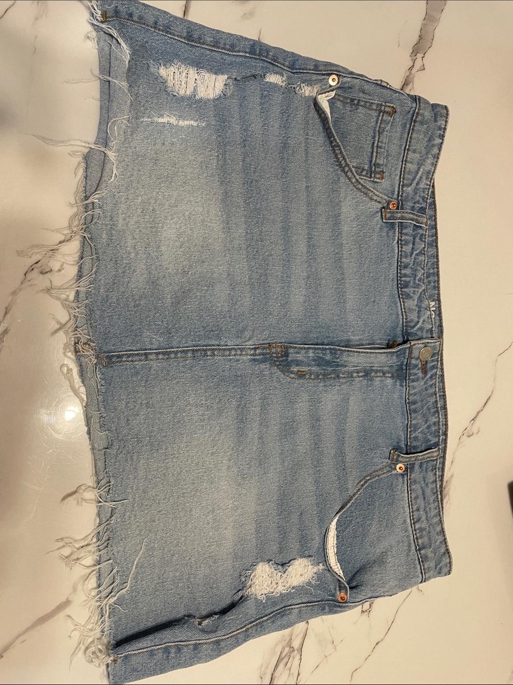 Light Wash Distressed Denim Mini Skirt